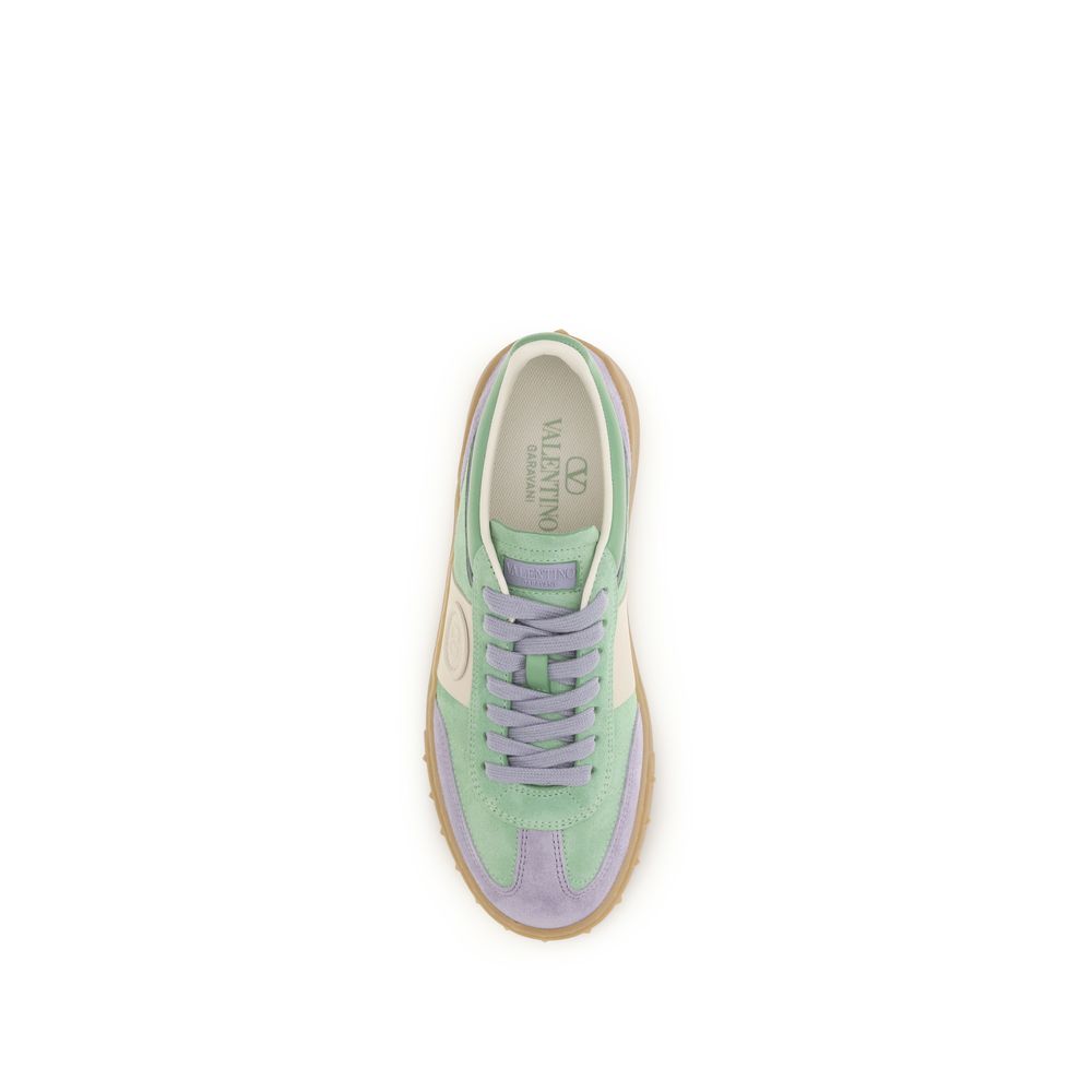 Experience the allure of Valentino Garavani's Multicolor Calf Leather Bos Taurus Low Top Sneakers, where exquisite craftsmanship meets contemporary elegance for the discerning individual.