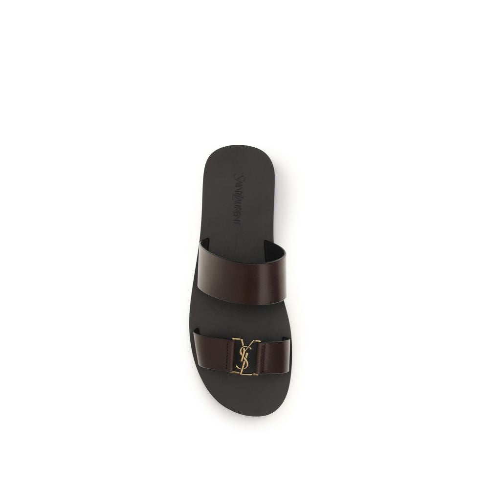 Indulge in the exquisite craftsmanship of Saint Laurent's Babylone Sandals, crafted from luxurious calf leather, embodying timeless elegance for every sophisticated occasion.