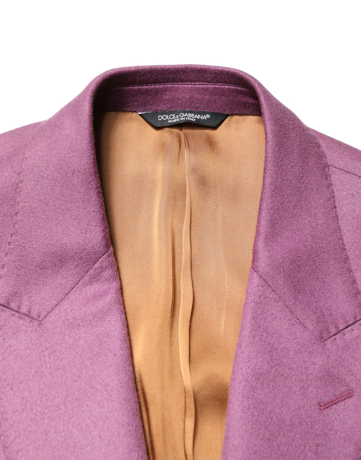 Indulge in the exquisite allure of the Dolce & Gabbana Purple Cashmere Slim Fit Blazer, where luxurious cashmere meets impeccable Italian craftsmanship, elevating your wardrobe to new heights of sophistication.