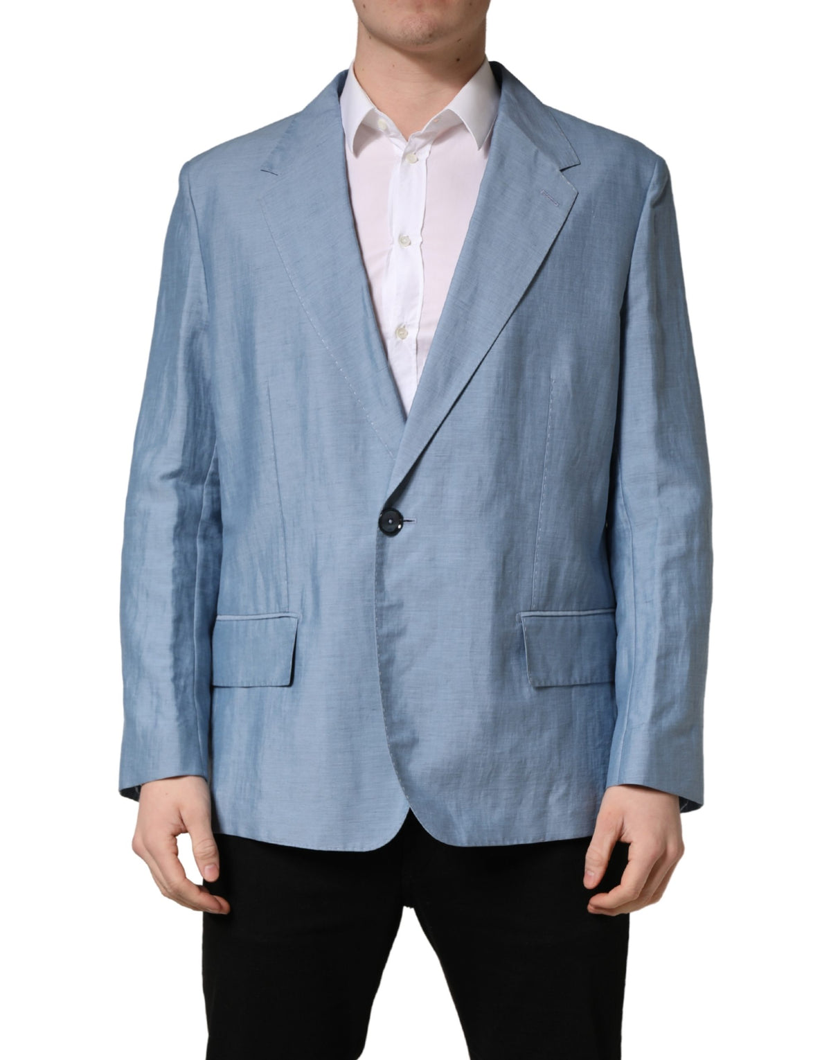 Elevate your wardrobe with the Dolce & Gabbana Light Blue Single Breasted Blazer, a masterpiece of Italian craftsmanship blending linen and nylon for timeless elegance.