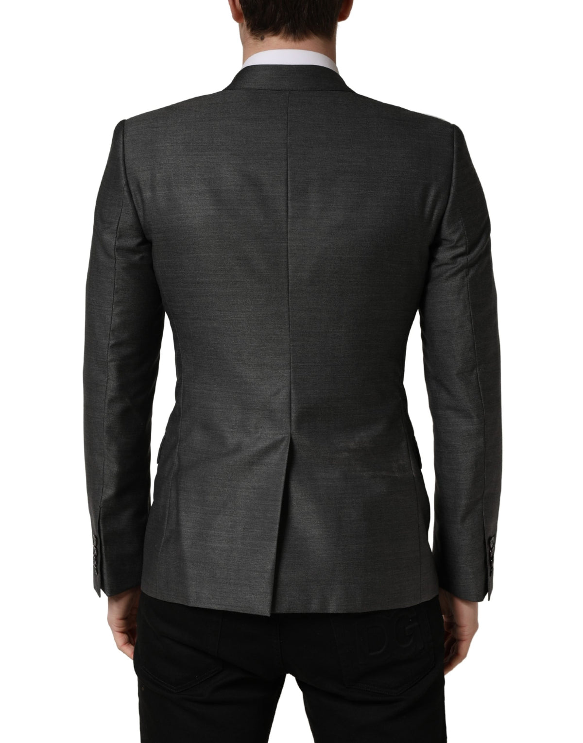 Experience the allure of Dolce & Gabbana's Dark Gray Wool Slim Fit Blazer, a timeless masterpiece crafted from luxurious virgin wool and silk, perfect for the discerning individual.