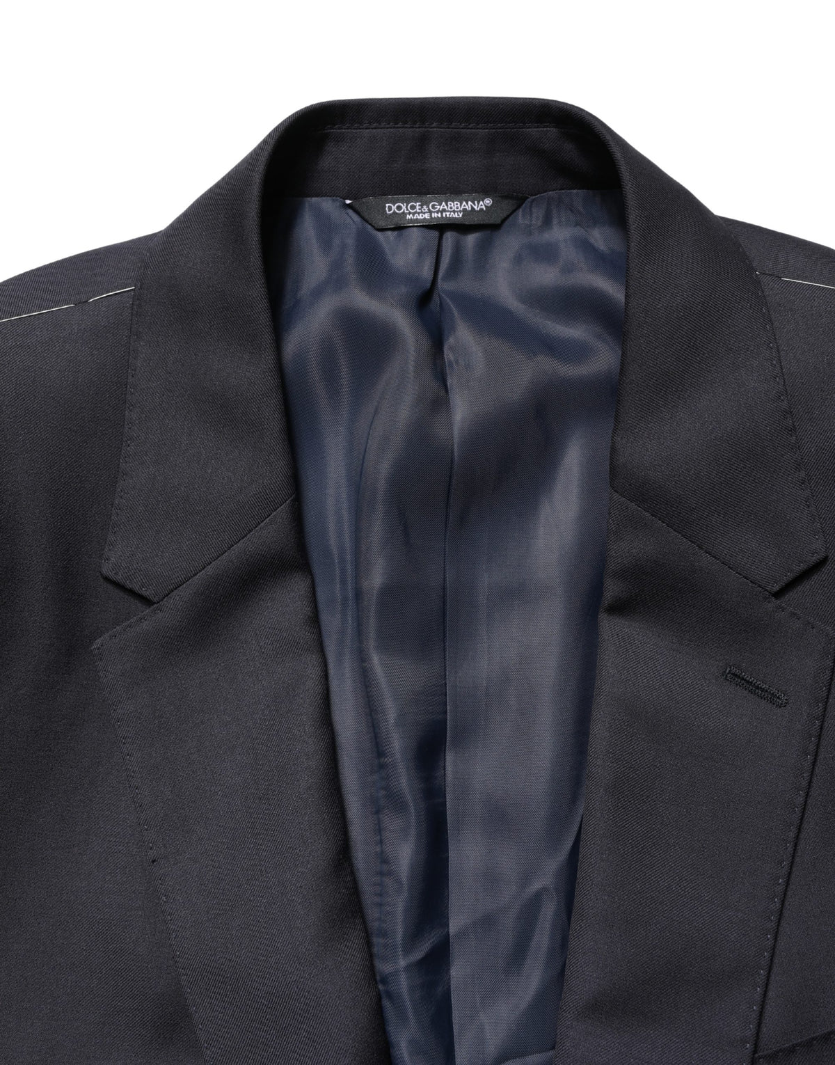 Elevate your wardrobe with the Dolce & Gabbana Black Wool Slim Fit Coat, a masterpiece of Italian craftsmanship in luxurious virgin wool, perfect for the discerning individual.