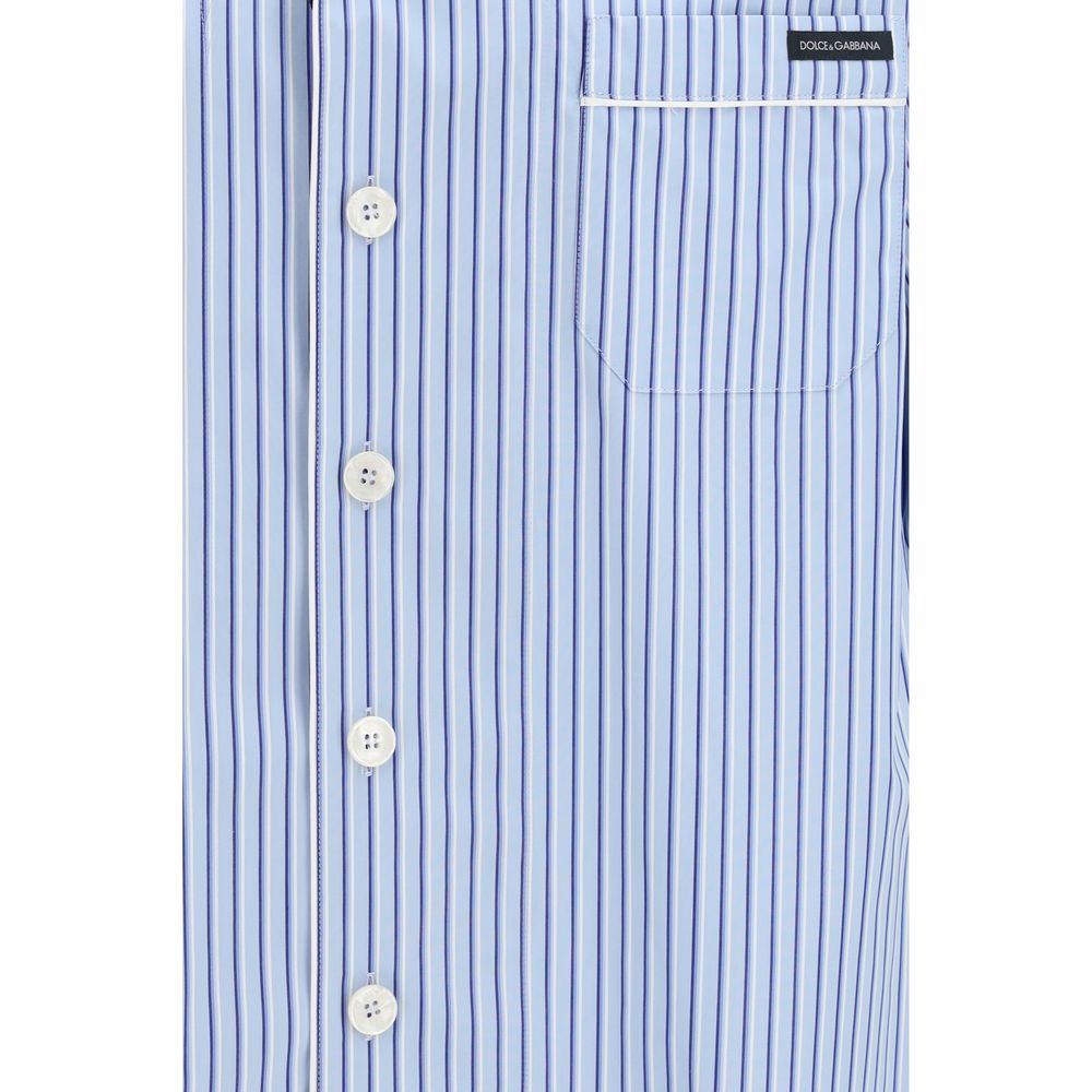 Elevate your summer style with the Dolce & Gabbana Blue Cotton Shortsleeve Shirt, a luxurious blend of 98% cotton and 2% silk, perfect for sophisticated occasions.