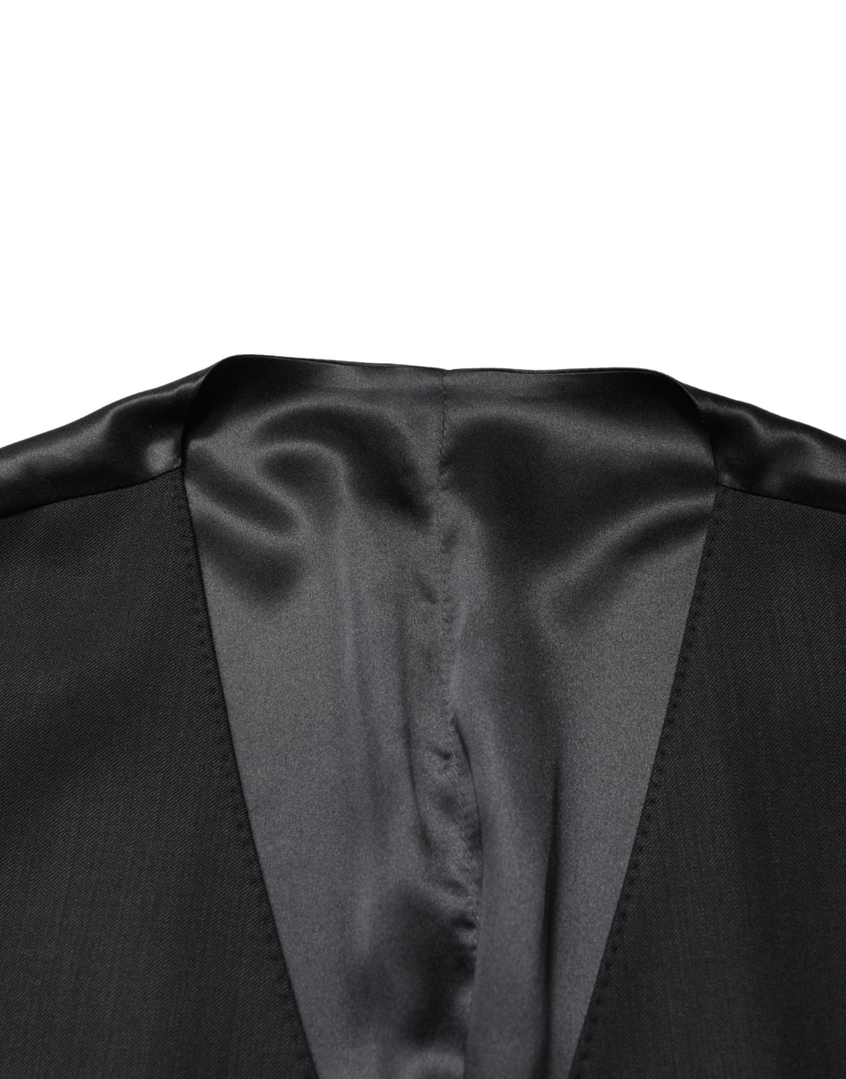 Elevate your formal wardrobe with the Dolce & Gabbana Black Wool Single Breasted Waistcoat Vest, a masterpiece of Italian craftsmanship in luxurious virgin wool, perfect for sophisticated occasions.