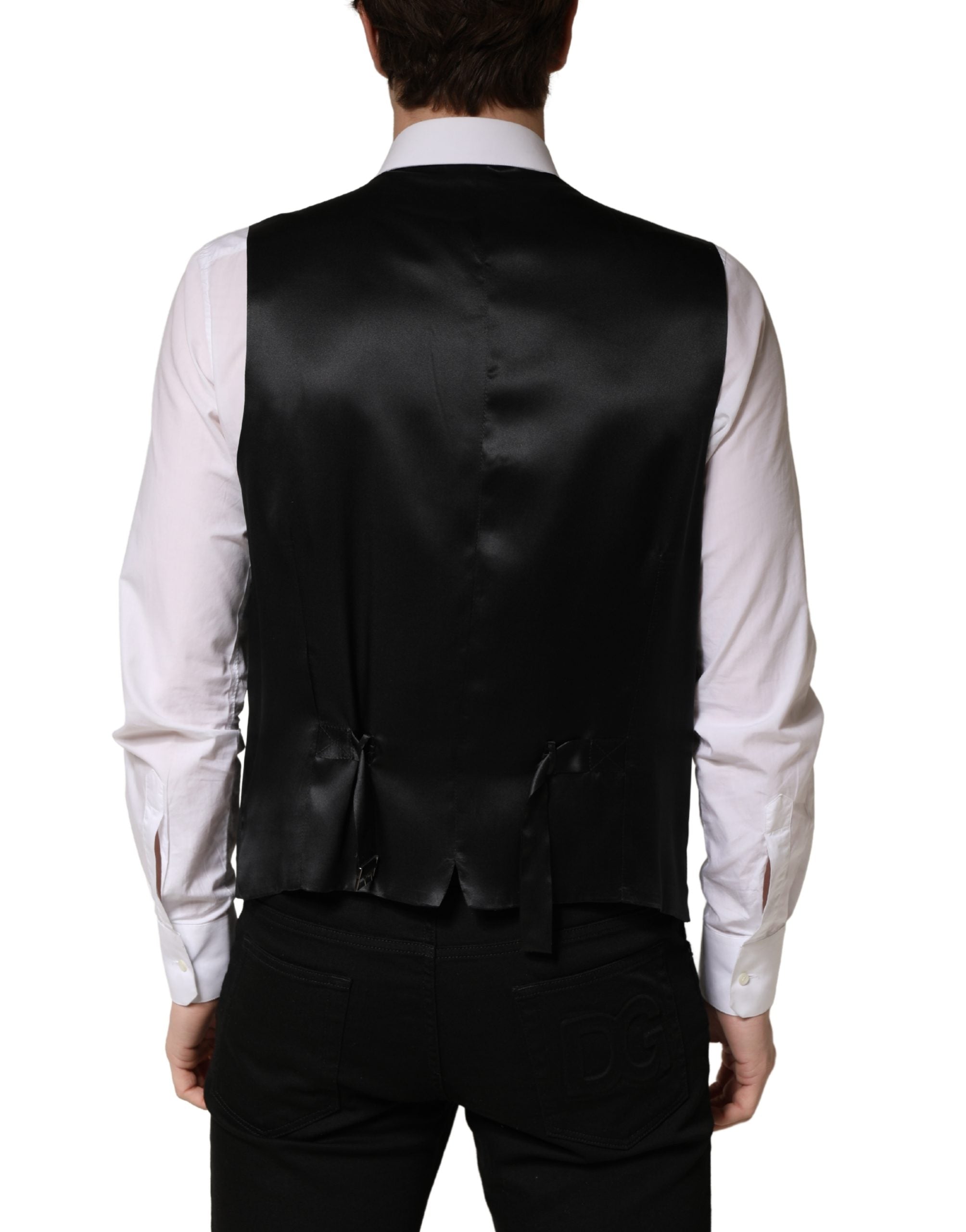 Elevate your formal wardrobe with the Dolce & Gabbana Black Wool Single Breasted Waistcoat Vest, a masterpiece of Italian craftsmanship in luxurious virgin wool, perfect for any sophisticated occasion.