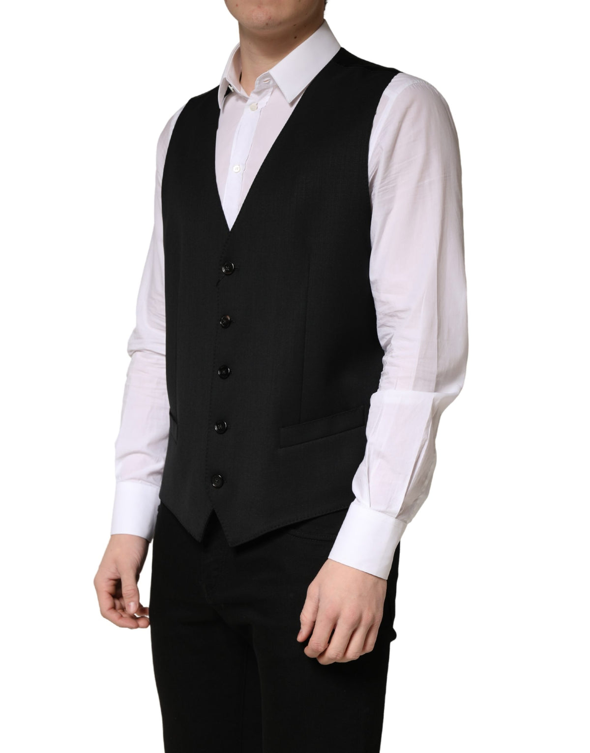 Elevate your formal wardrobe with the Dolce & Gabbana Black Wool Single Breasted Waistcoat Vest, a masterpiece of Italian craftsmanship in luxurious virgin wool, perfect for commanding presence at any occasion.