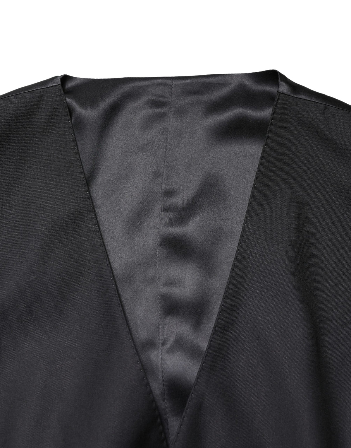 Indulge in the timeless elegance of the Dolce & Gabbana Black Wool Single Breasted Waistcoat Vest, crafted from premium materials for a sophisticated allure that elevates any ensemble.