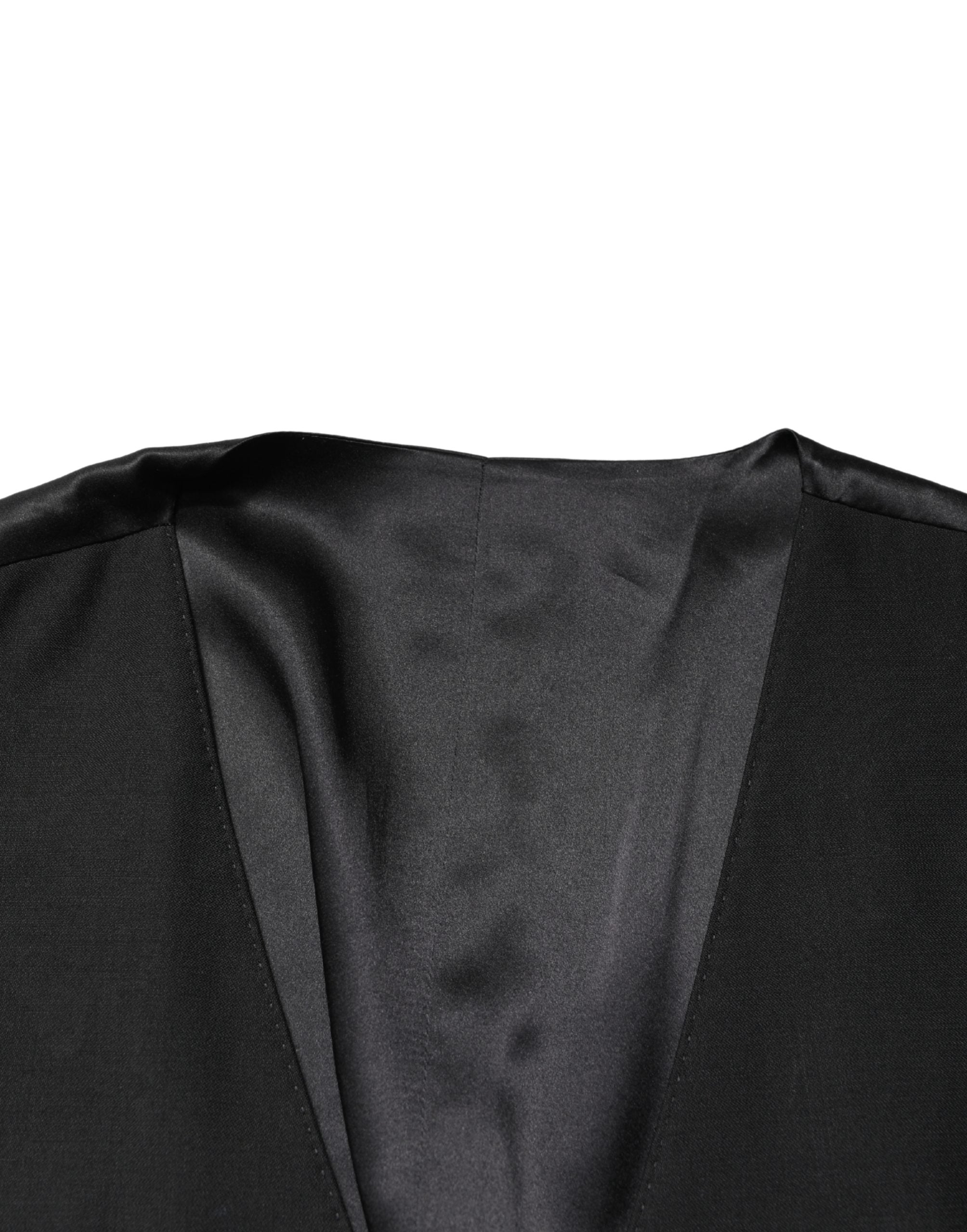 Elevate your style with the Dolce & Gabbana Black Wool Single Breasted Waistcoat Vest, crafted from luxurious virgin wool, embodying timeless sophistication and exquisite Italian craftsmanship.