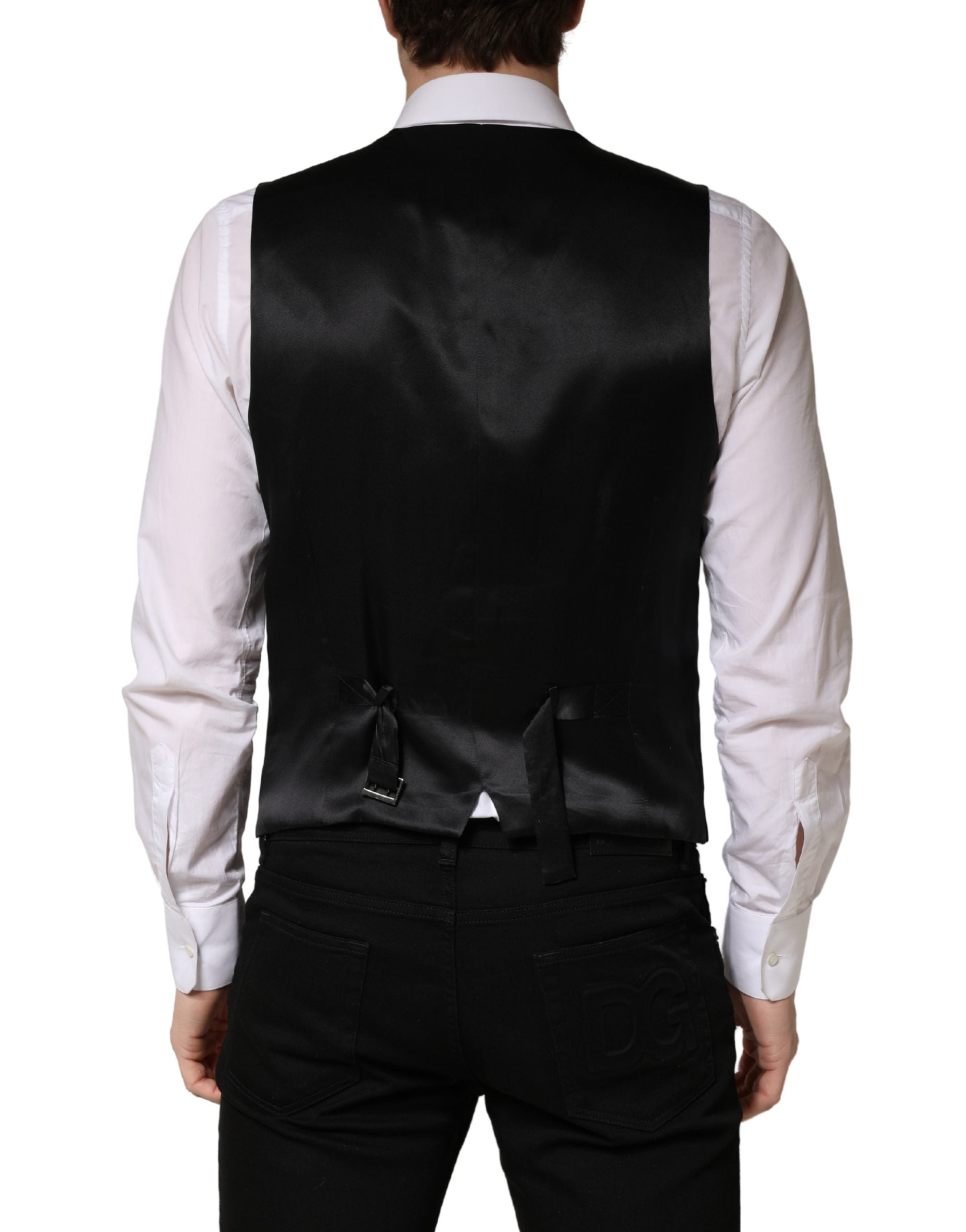 Elevate your wardrobe with the Dolce & Gabbana Black Wool Single Breasted Waistcoat Vest, a masterpiece of Italian craftsmanship that embodies timeless elegance and luxurious allure.