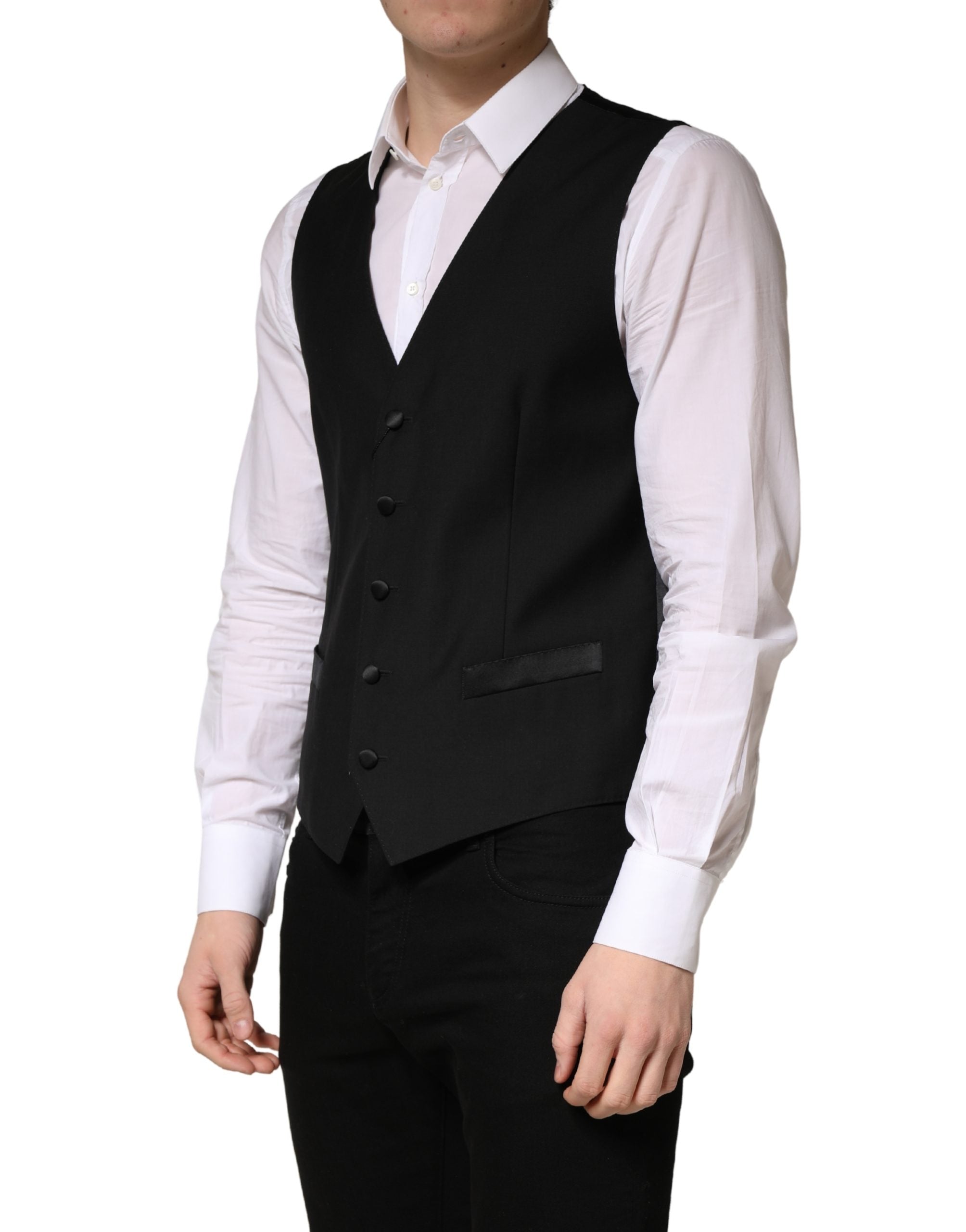 Discover the Dolce & Gabbana Black Wool Single Breasted Waistcoat Vest, a masterpiece of Italian craftsmanship in luxurious virgin wool, perfect for the discerning modern individual.