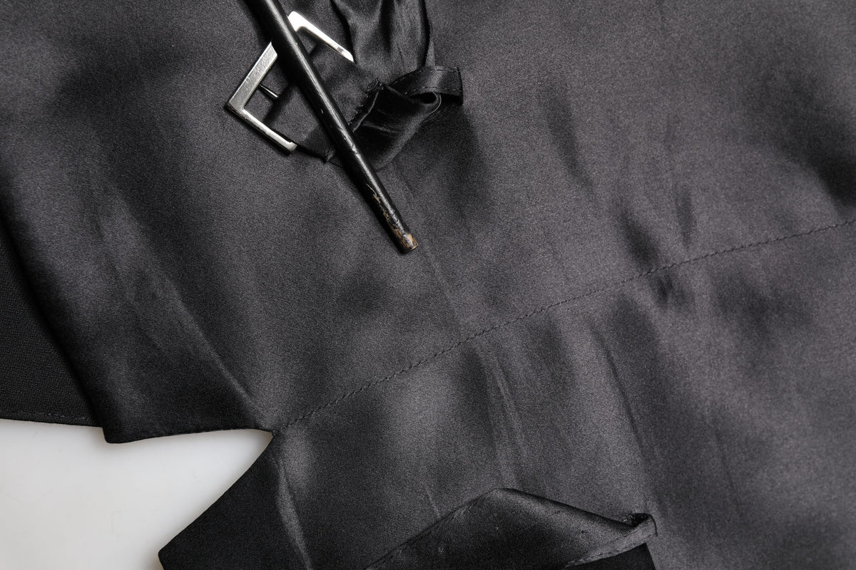 Experience the allure of Dolce & Gabbana's Black Wool Single Breasted Waistcoat Vest, a masterpiece of Italian craftsmanship, blending luxurious virgin wool with timeless elegance for the discerning individual.