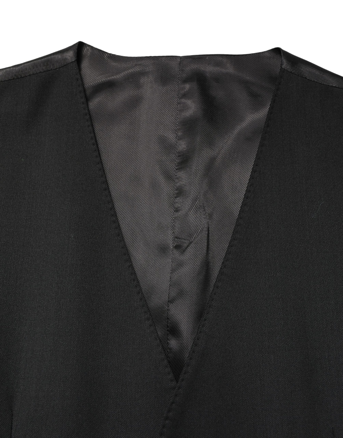 Elevate your wardrobe with the Dolce & Gabbana Black Wool Single Breasted Waistcoat Vest, a masterpiece of Italian craftsmanship that embodies timeless elegance and sophistication.