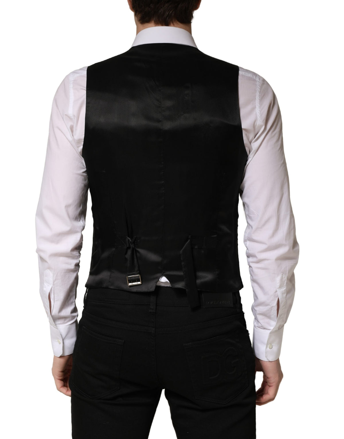 Elevate your wardrobe with the Dolce & Gabbana Black Wool Single Breasted Waistcoat Vest, a masterpiece of Italian craftsmanship that embodies timeless elegance and sophistication.