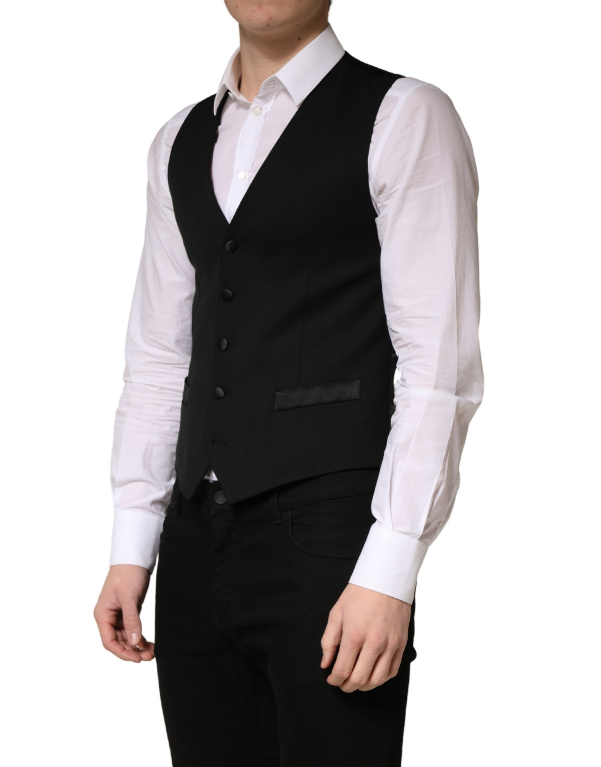 Elevate your wardrobe with the Dolce & Gabbana Black Wool Single Breasted Waistcoat Vest, a masterpiece of Italian craftsmanship that exudes timeless elegance and sophistication.
