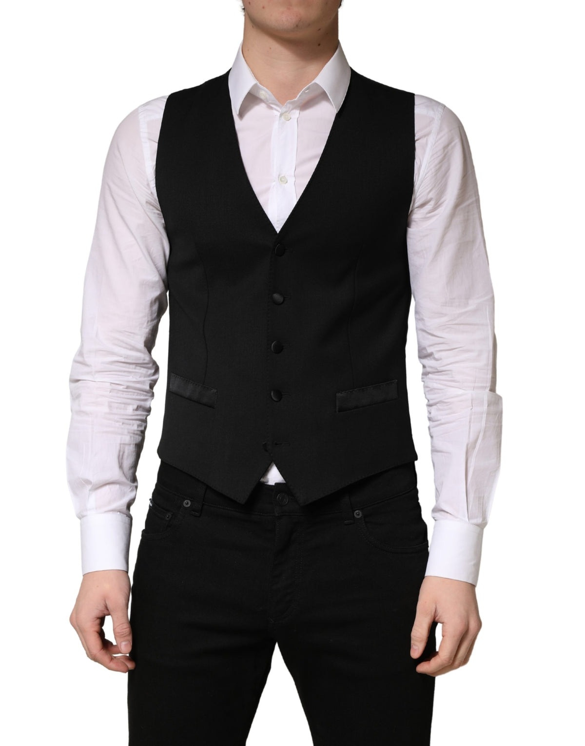 Elevate your style with the Dolce & Gabbana Black Wool Single Breasted Waistcoat Vest, a masterpiece of Italian craftsmanship that embodies timeless elegance and refined luxury.