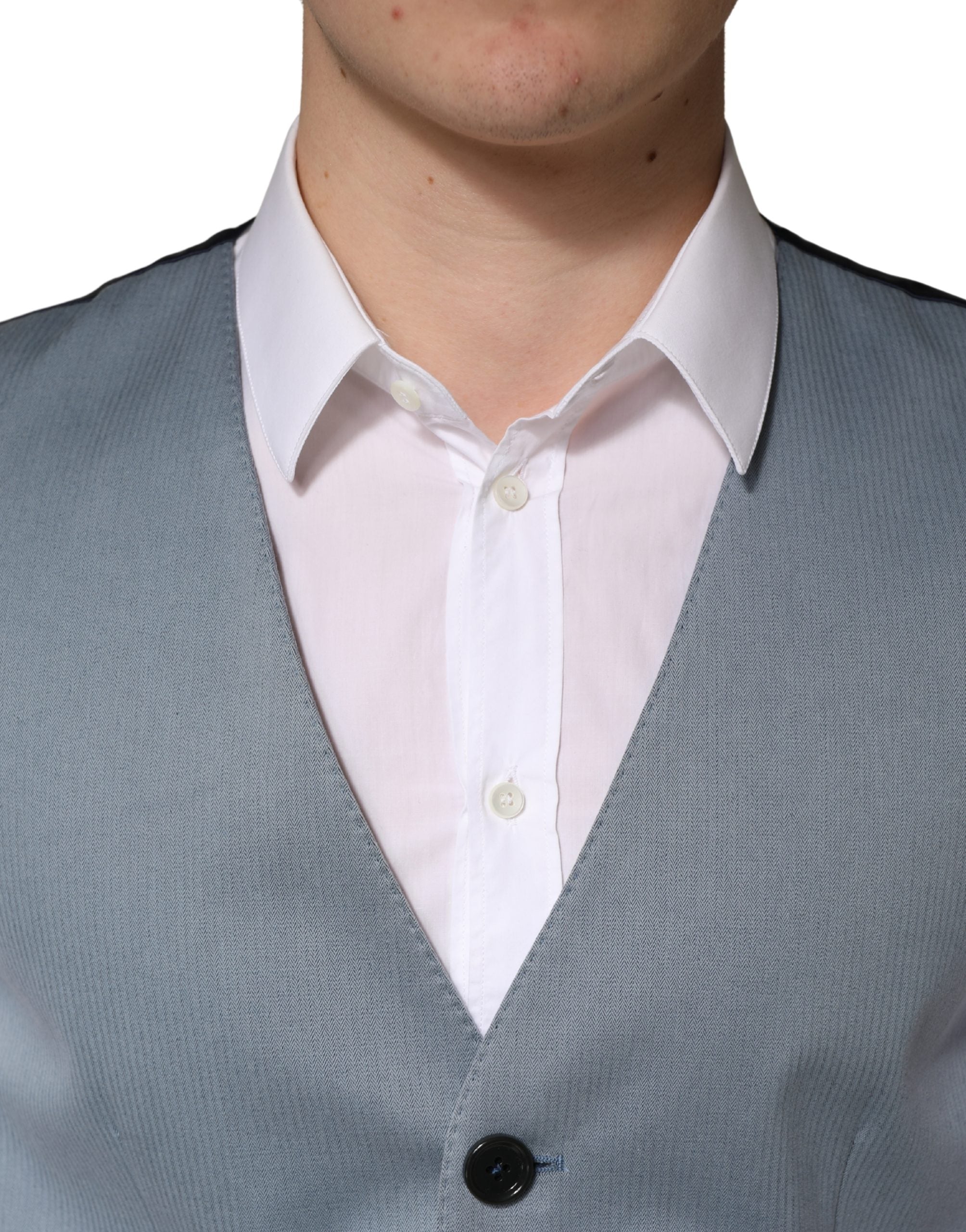 Elevate your wardrobe with the Dolce & Gabbana Gray Wool Single Breasted Waistcoat Vest, a masterpiece of Italian craftsmanship that embodies timeless elegance and sophistication.