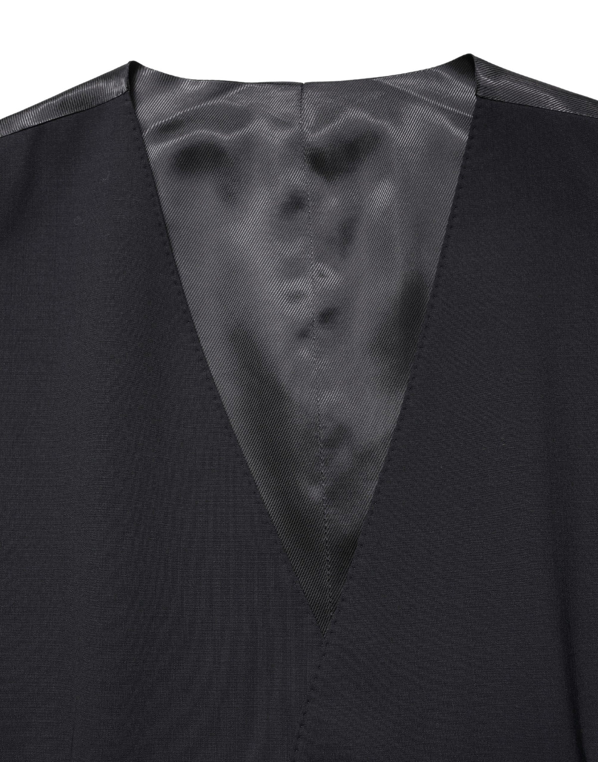 Elevate your wardrobe with the Dolce & Gabbana Black Wool Single Breasted Waistcoat Vest, a masterpiece of Italian craftsmanship that embodies sophistication and timeless elegance.