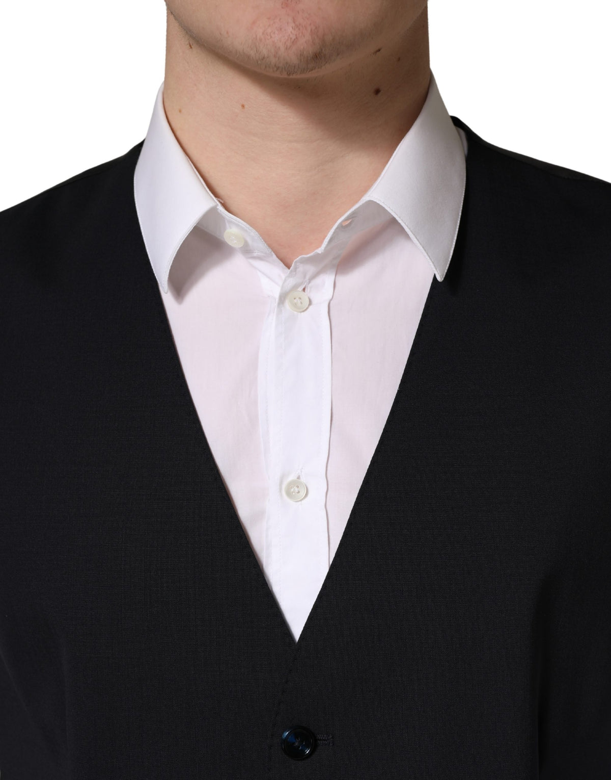 Discover the exquisite Dolce & Gabbana Black Wool Single Breasted Waistcoat Vest, a timeless piece crafted from luxurious virgin wool, embodying sophistication and elegance for any occasion.
