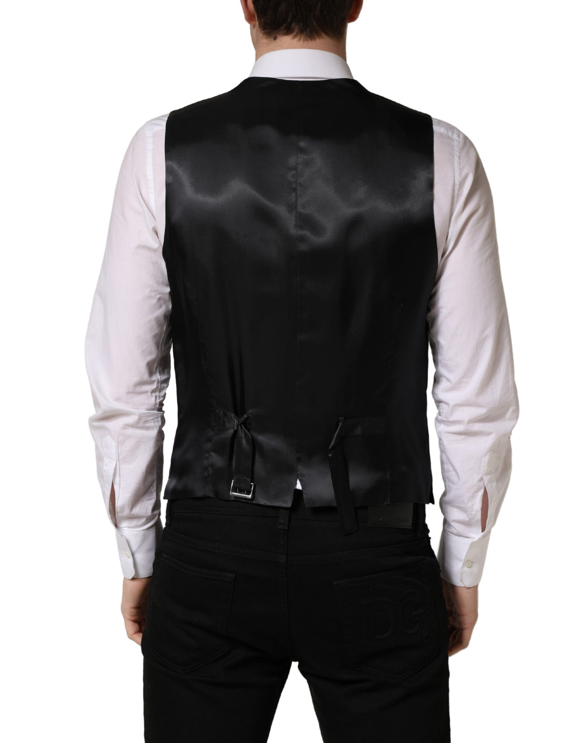 Elevate your style with the Dolce & Gabbana Black Wool Single Breasted Waistcoat Vest, a masterpiece of Italian craftsmanship, blending luxurious virgin wool with refined elegance for the discerning individual.