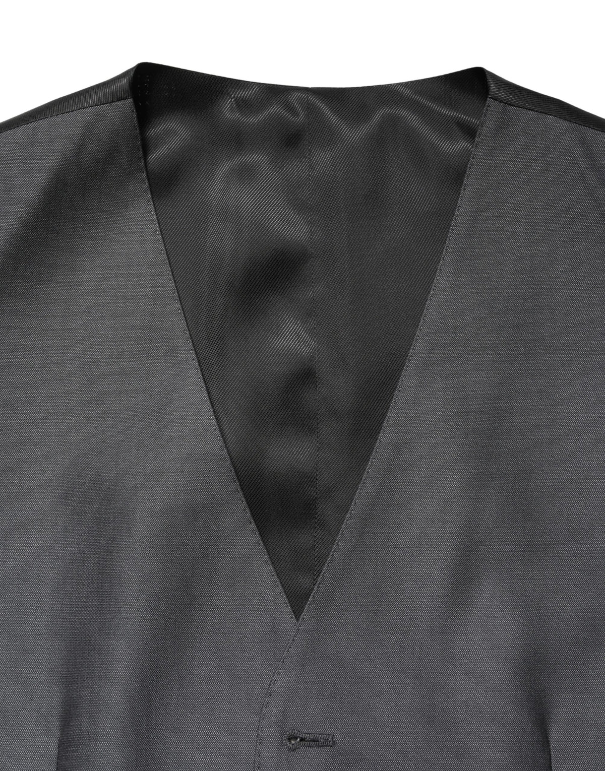 Elevate your formal wardrobe with the Dolce & Gabbana Dark Gray Waistcoat Vest, a masterpiece of virgin wool and silk, embodying exquisite craftsmanship and timeless elegance.