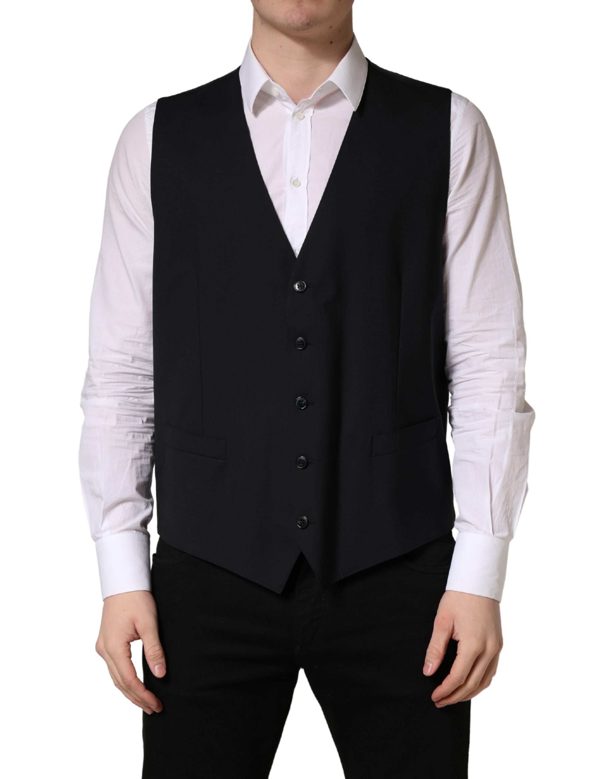 Experience the allure of Dolce & Gabbana's Black Wool Single Breasted Waistcoat, a masterpiece of Italian craftsmanship that elevates your style with luxurious sophistication.