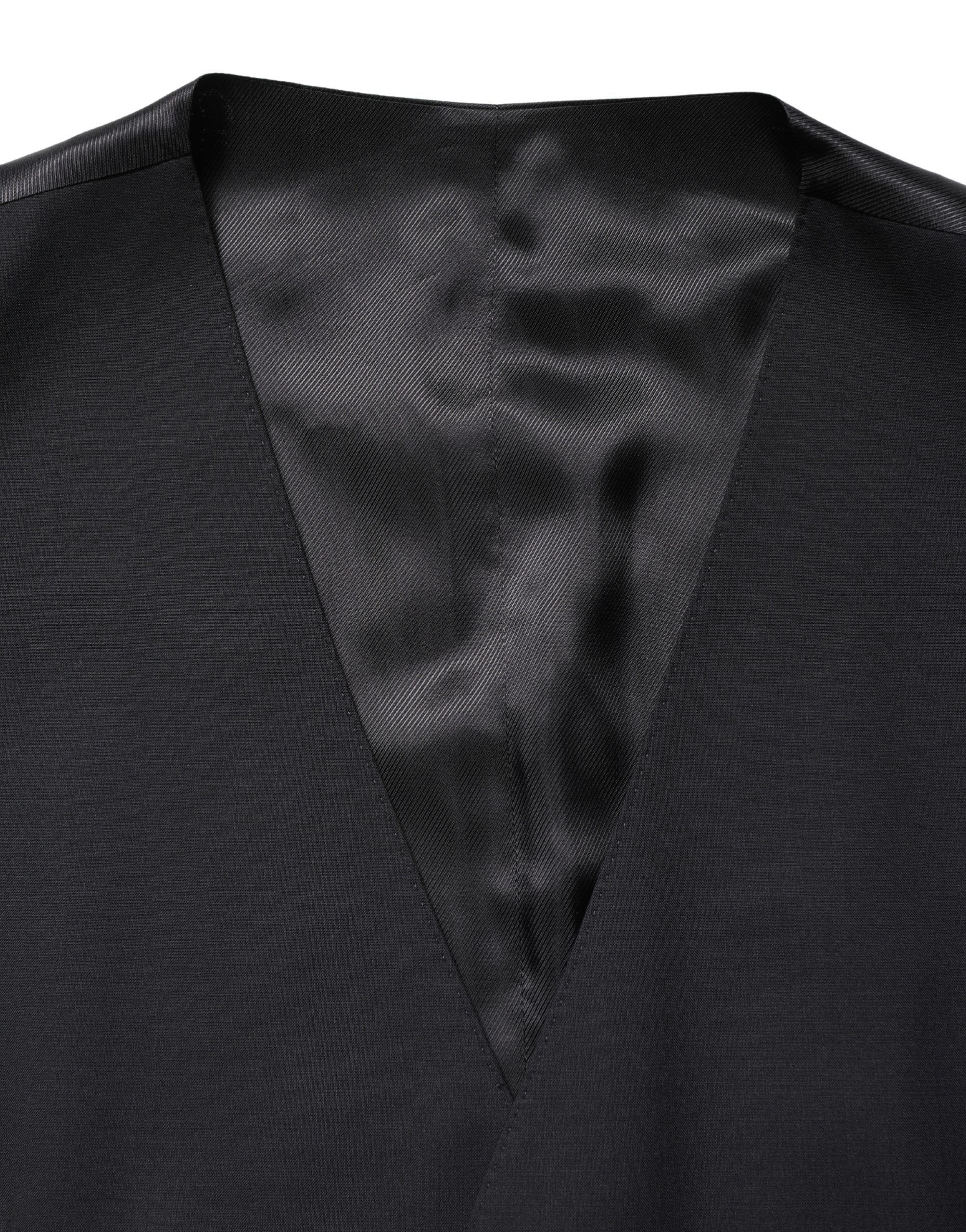 Indulge in the exquisite Dolce & Gabbana Black Wool Single Breasted Waistcoat, a masterpiece of Italian craftsmanship, embodying timeless elegance and sophistication for the discerning individual.