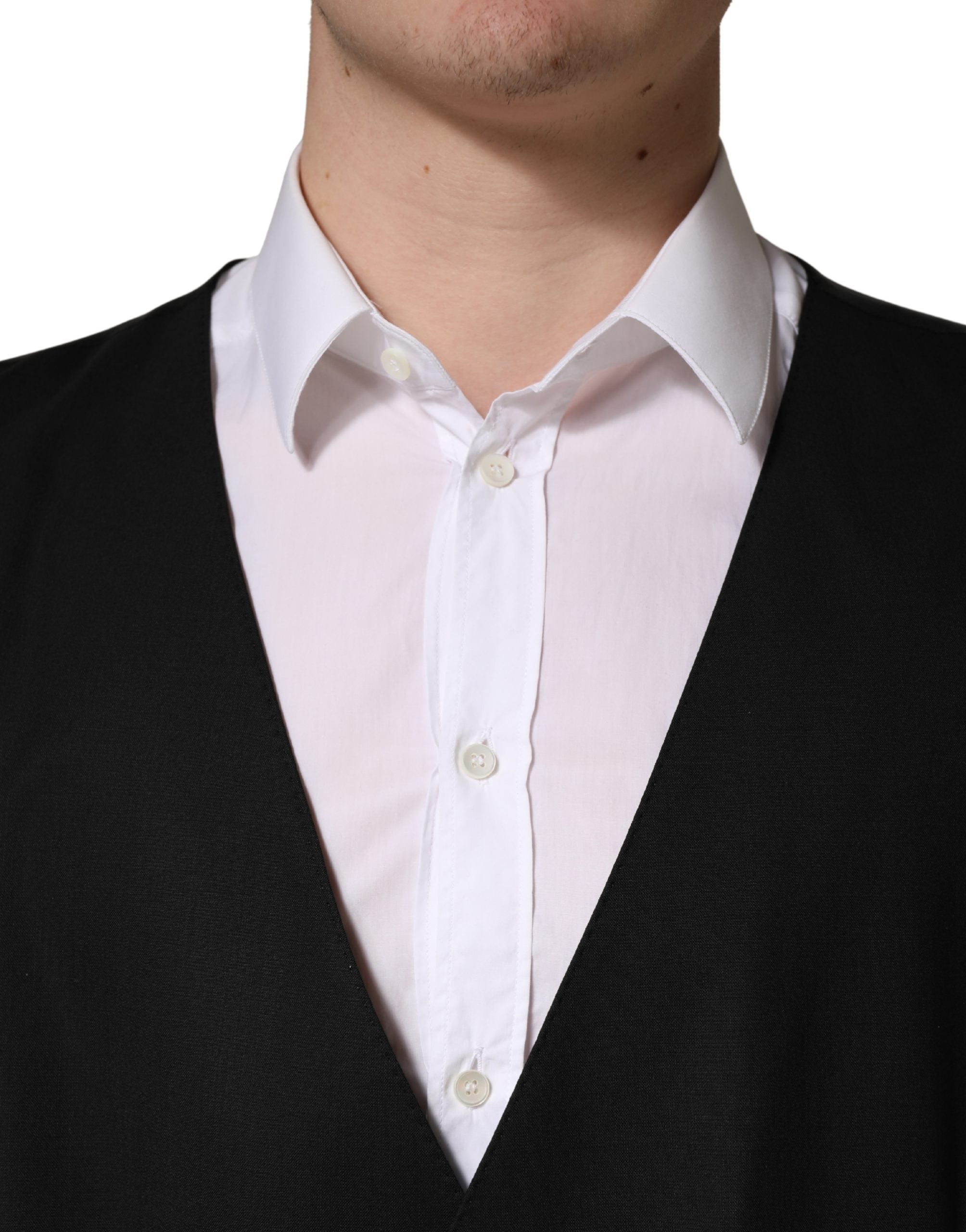 Elevate your elegance with the Dolce & Gabbana Black Wool Single Breasted Waistcoat Vest, a masterpiece of Italian craftsmanship, blending luxurious materials with timeless sophistication.