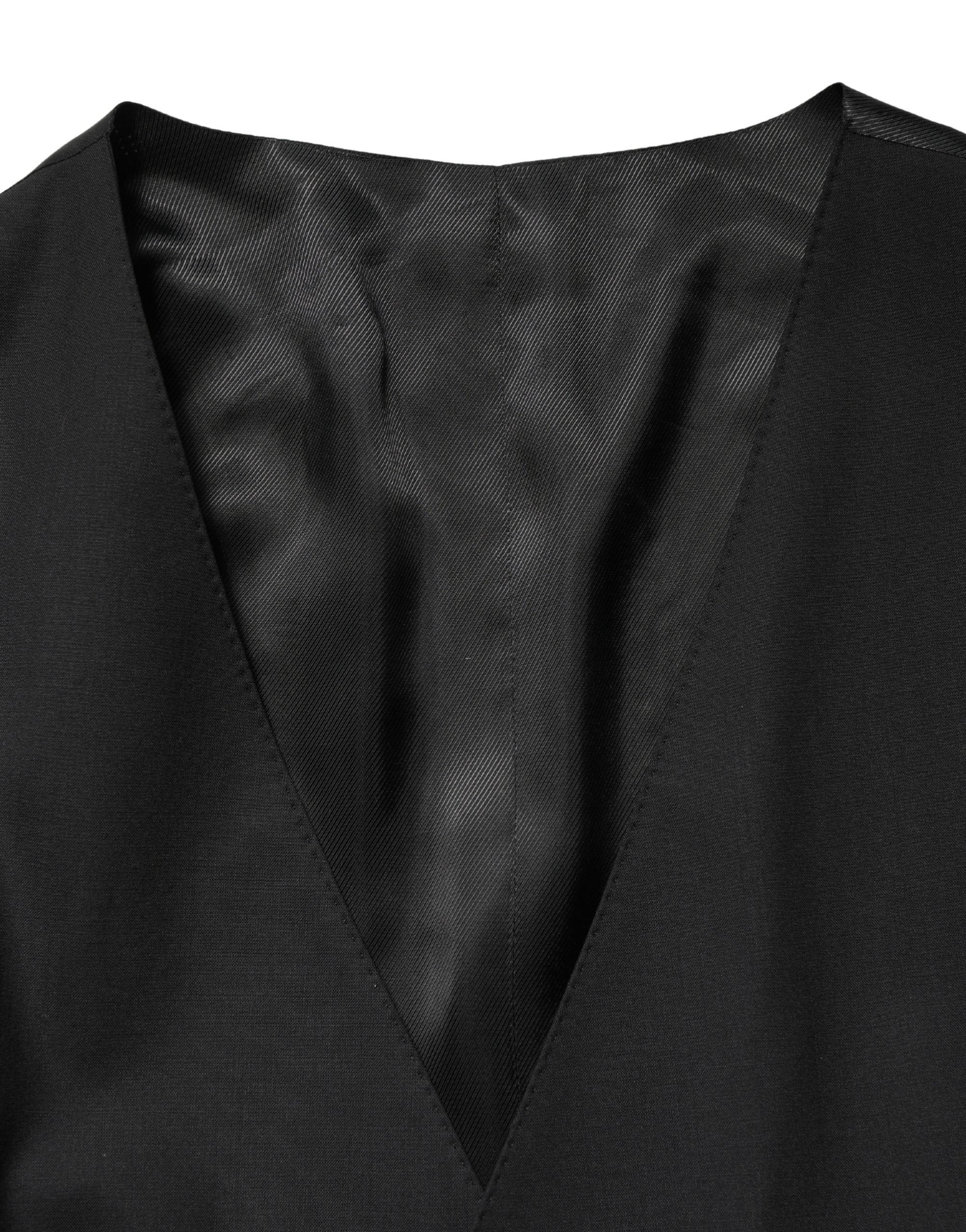Discover the Dolce & Gabbana Black Wool Single Breasted Waistcoat Vest, a masterpiece of Italian craftsmanship, blending luxurious materials for an unparalleled elegance.