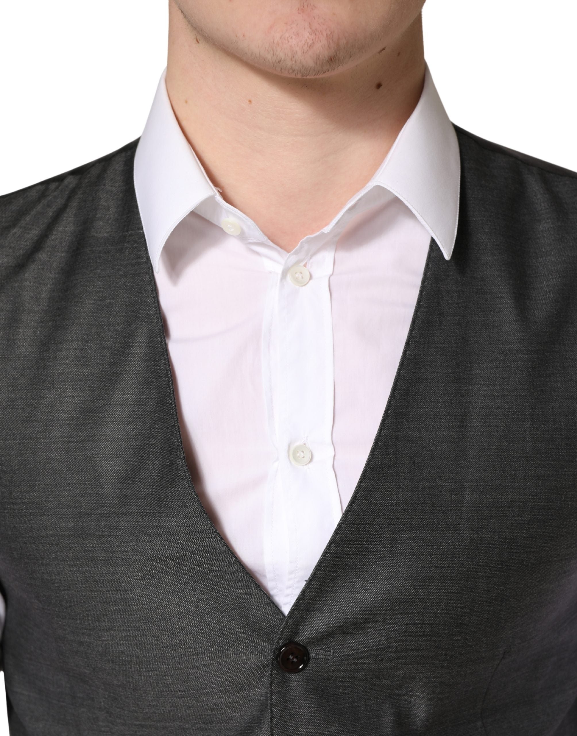 Discover the exquisite Dolce & Gabbana Dark Gray Wool Dress Formal Waistcoat Vest, a masterpiece of Italian craftsmanship that elevates your formal attire with luxurious virgin wool and silk.