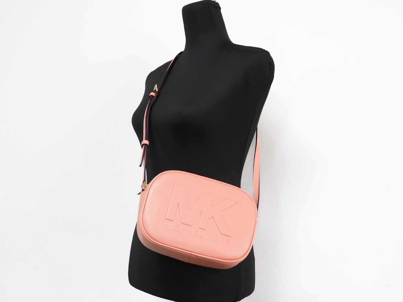 Elevate your style with the Michael Kors Jet Set Travel Medium Sherbert Leather Oval Camera Crossbody Bag, a luxurious blend of refined craftsmanship and timeless elegance.