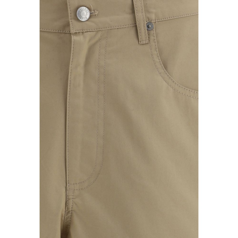 Elevate your summer wardrobe with Moschino Beige Cotton Bermuda Shorts, a luxurious blend of comfort and style, crafted for the discerning individual.