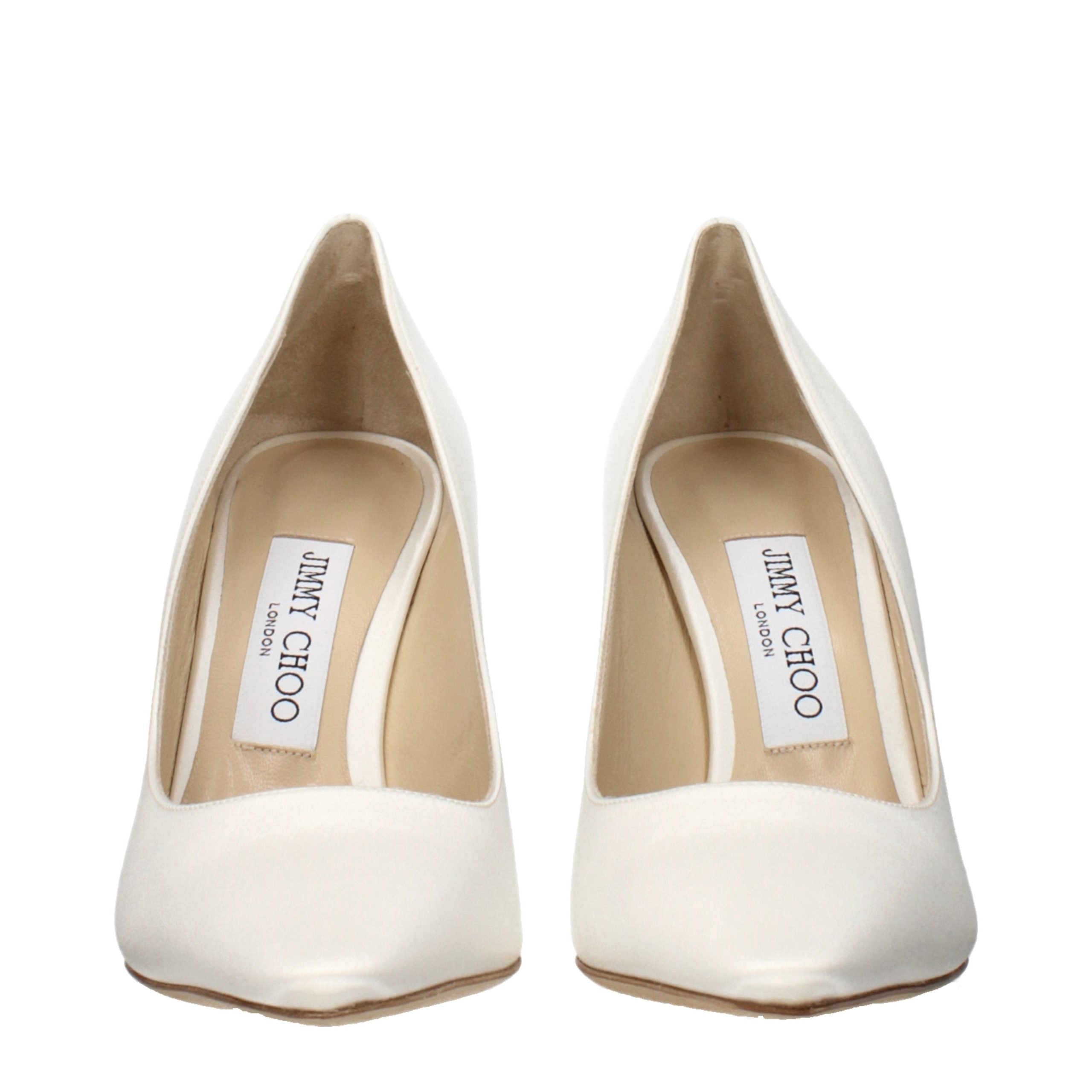 Indulge in the exquisite elegance of Jimmy Choo Beige Satin Platform Pumps, where exceptional craftsmanship meets timeless sophistication for the discerning individual.