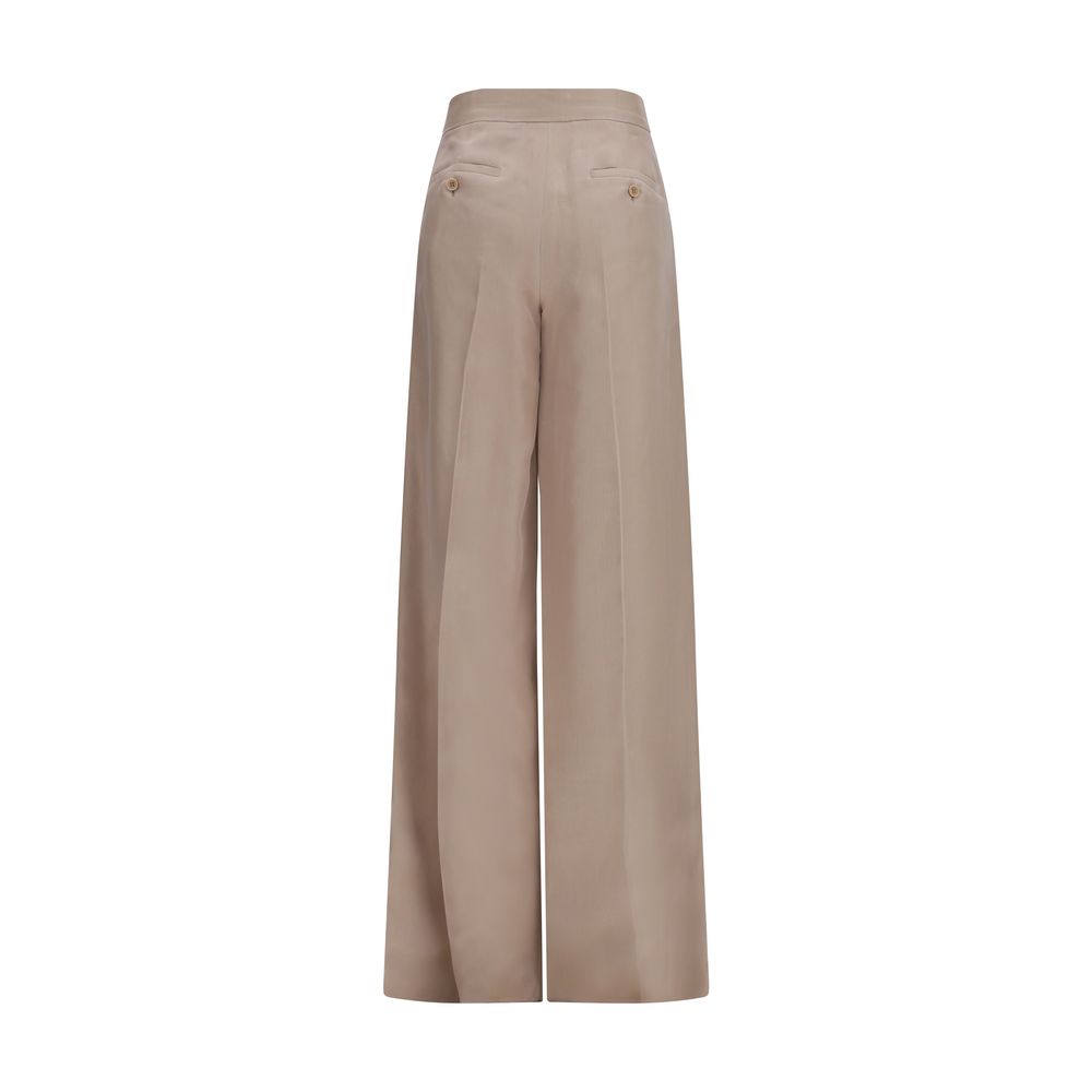 Discover the exquisite Max Mara Beige Silk Casual Pants, a timeless blend of luxury and elegance, crafted from 100% silk for unparalleled sophistication in every moment.