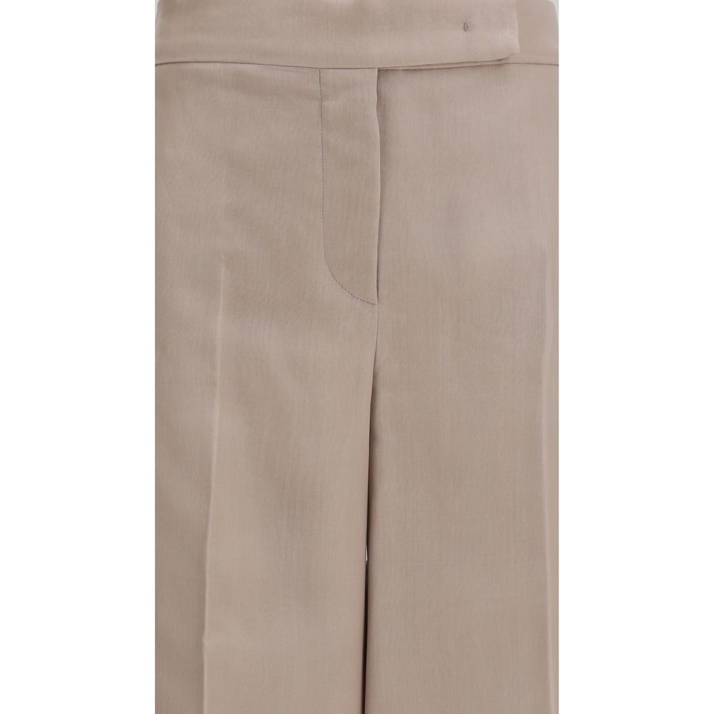 Elevate your wardrobe with Max Mara's Beige Silk Casual Pants, a timeless blend of luxury and elegance crafted from 100% silk, perfect for any sophisticated occasion.