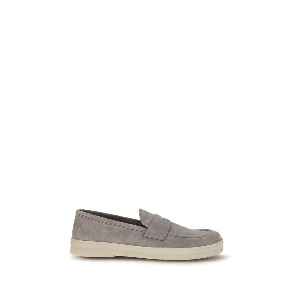 Elevate your style with Prada Gray Calf Leather Bos Taurus Slip-On Loafers, where exquisite craftsmanship meets timeless elegance for the discerning individual.
