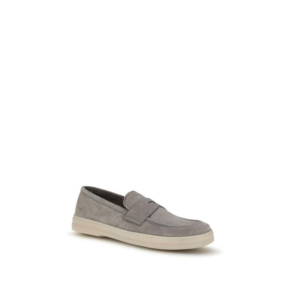 Elevate your style with Prada Gray Calf Leather Bos Taurus Slip-On Loafers, where exquisite craftsmanship meets timeless elegance for the discerning individual.