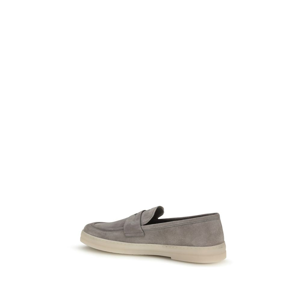 Elevate your style with Prada Gray Calf Leather Bos Taurus Slip-On Loafers, where exquisite craftsmanship meets timeless elegance, perfect for the discerning individual.