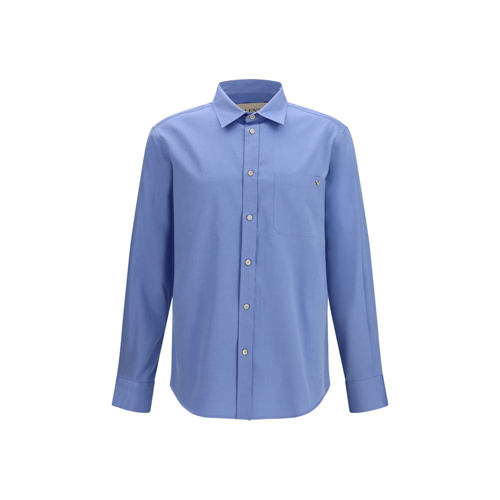 Elevate your wardrobe with the Valentino Blue Cotton Shirt, a masterpiece of 100% lightweight cotton, embodying timeless elegance and refined sophistication for every occasion.