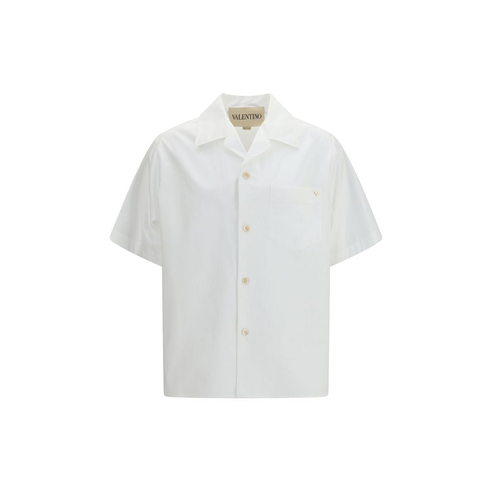 Discover the Valentino White Cotton Shirt, a masterpiece of pure cotton poplin from the SS26 collection, embodying effortless luxury and timeless elegance for the discerning individual.