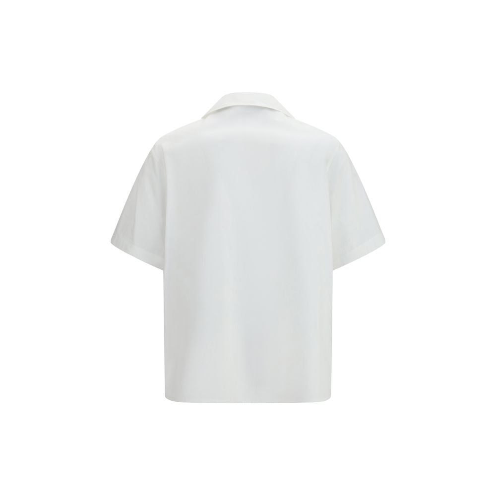 Experience the allure of the Valentino White Cotton Shirt, crafted from pure cotton poplin for effortless elegance, embodying luxury and sophistication in every stitch.
