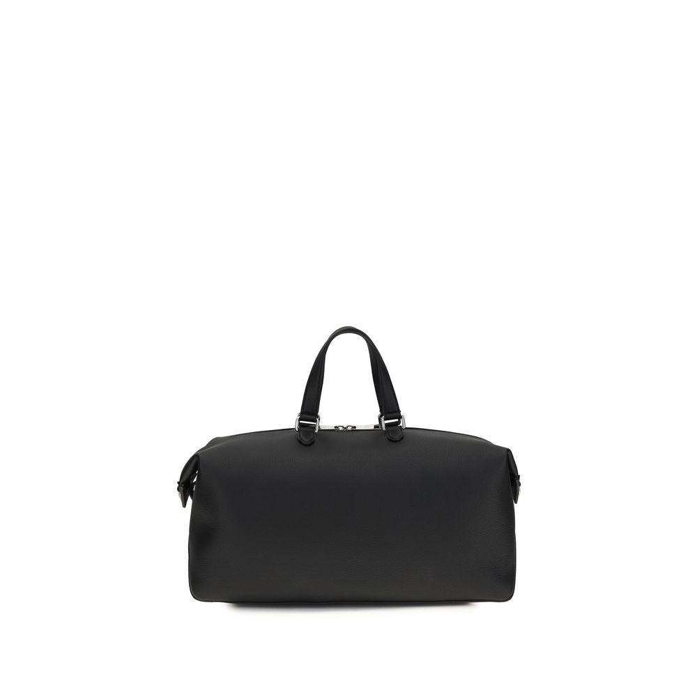 Discover the Fendi Black Calf Leather Bos Taurus Duffle Bag, a masterpiece of exquisite craftsmanship and timeless elegance, perfect for the discerning traveler.