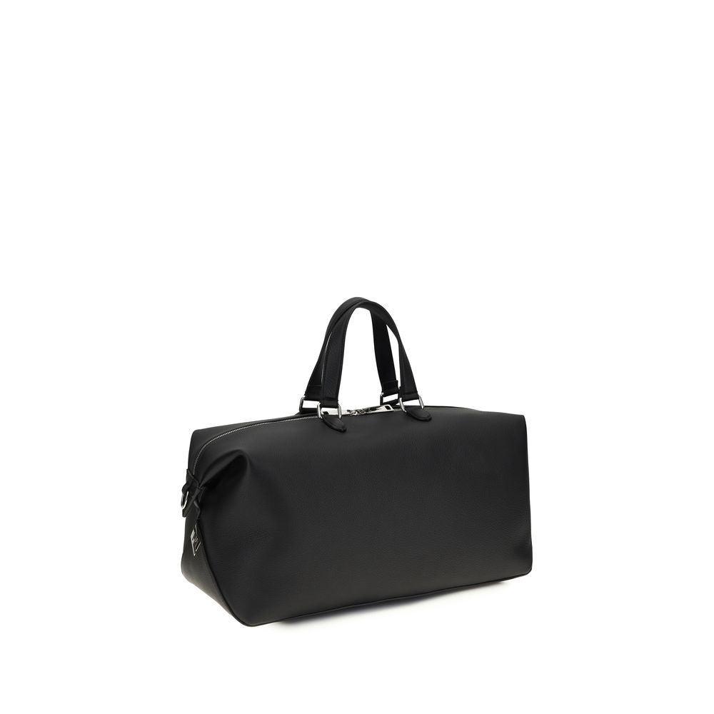Indulge in the opulence of Fendi's Black Calf Leather Bos Taurus Luggage, a masterpiece of craftsmanship and design, perfect for the discerning traveler seeking unparalleled luxury.