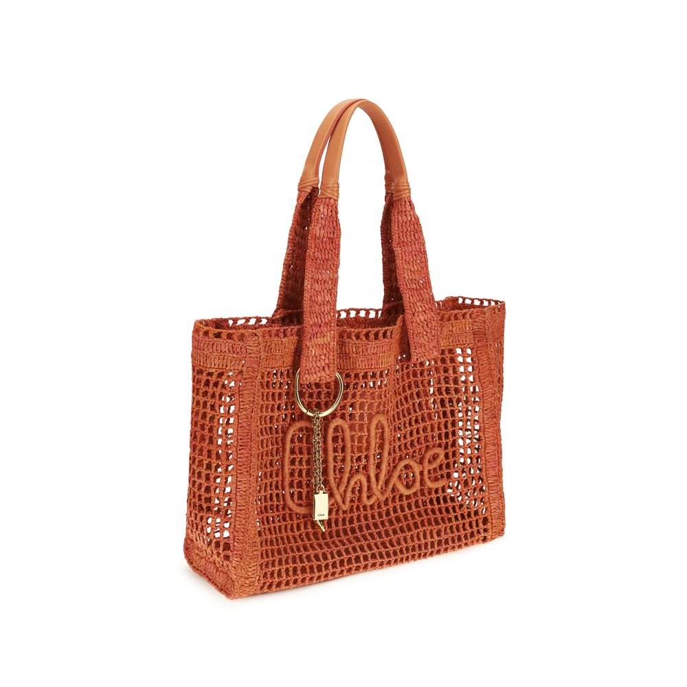 Indulge in the Chloé Multicolor Raffia Shoulder Bag, a handcrafted masterpiece of crocheted raffia and buffalo leather, embodying summer elegance and timeless luxury.