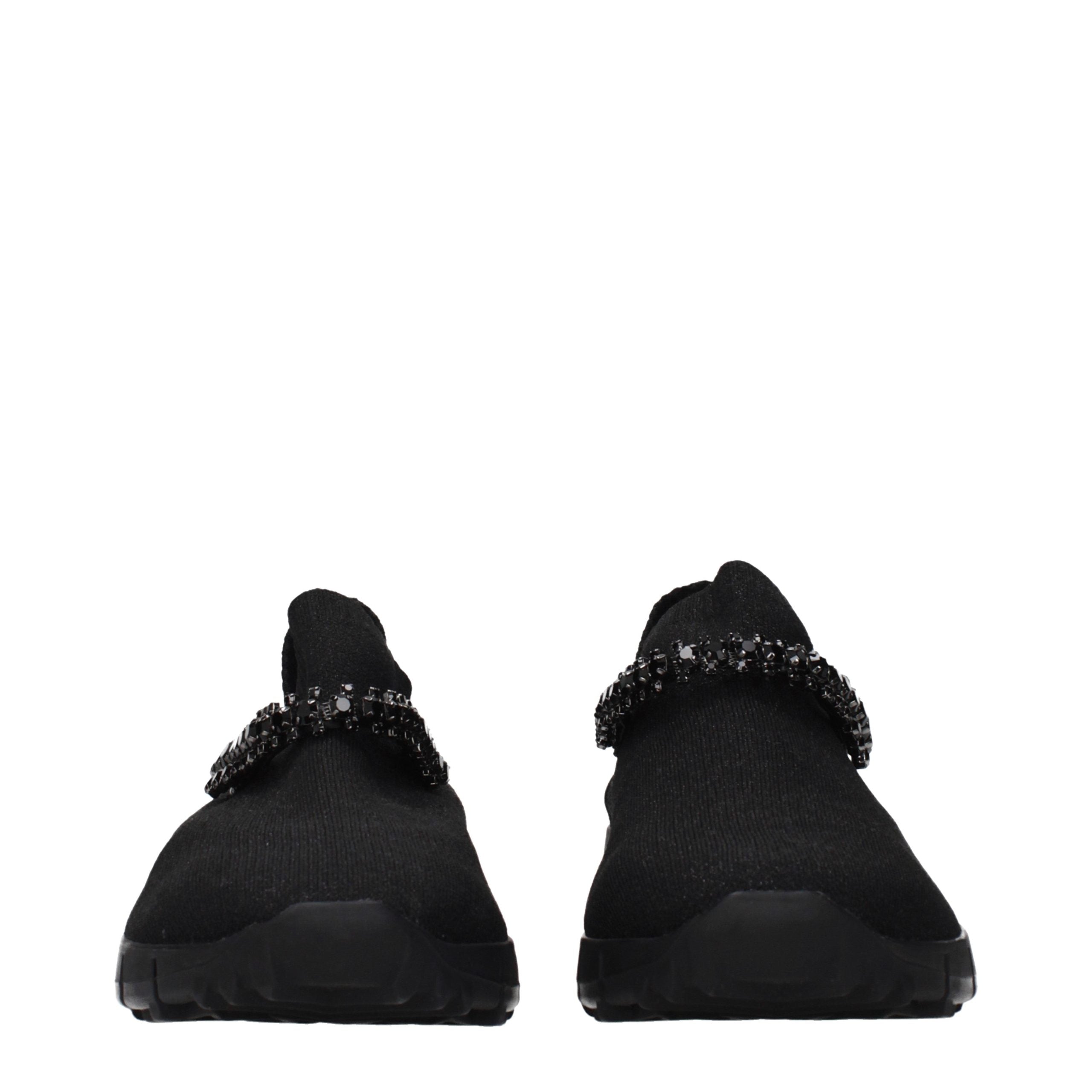 Experience the exquisite craftsmanship of Jimmy Choo Black Fabric Slip-On Loafers, where timeless elegance meets luxurious comfort for the discerning individual.