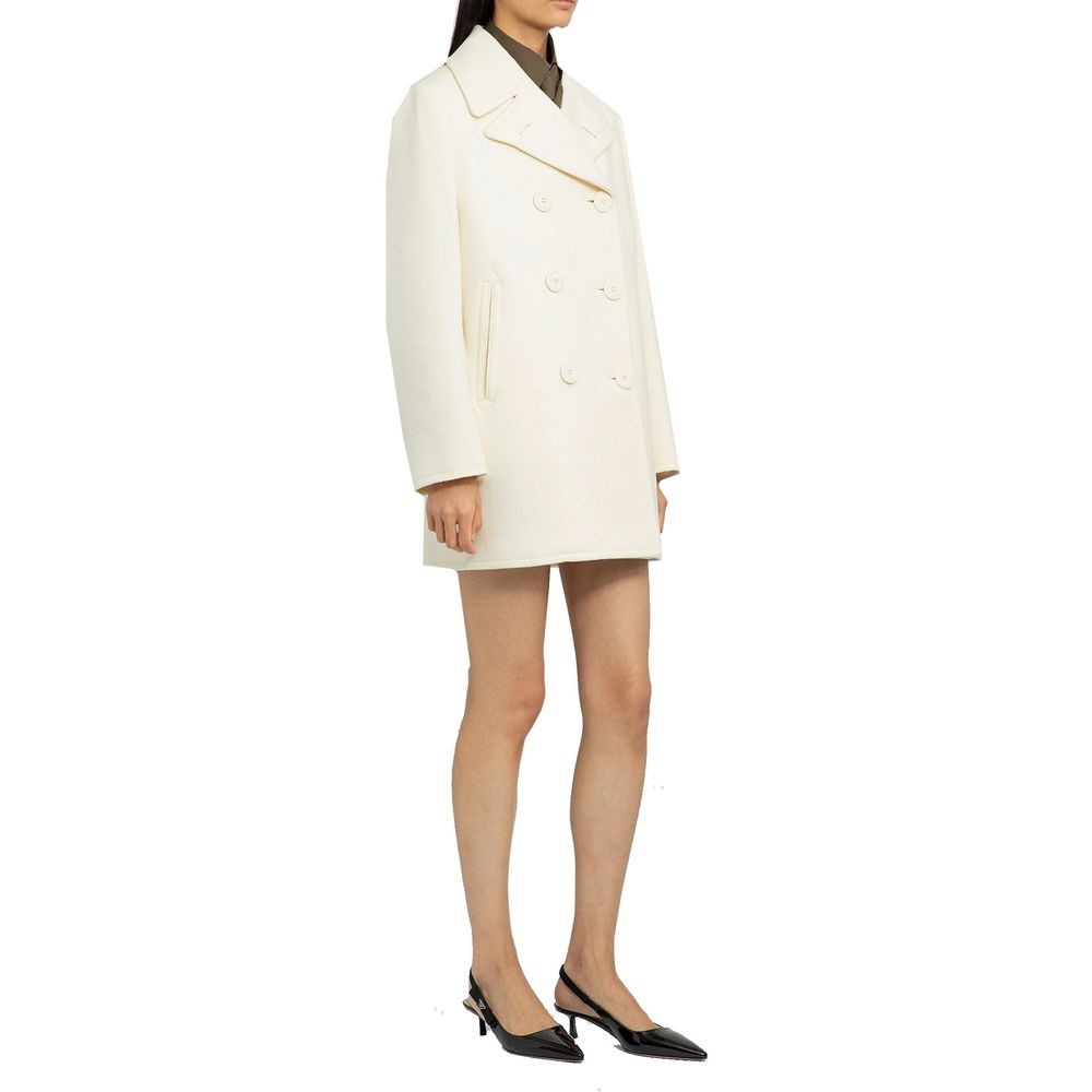 Elevate your wardrobe with the Prada White Wool Coat, a masterpiece of Italian craftsmanship in 100% premium wool, embodying timeless elegance and sophistication.