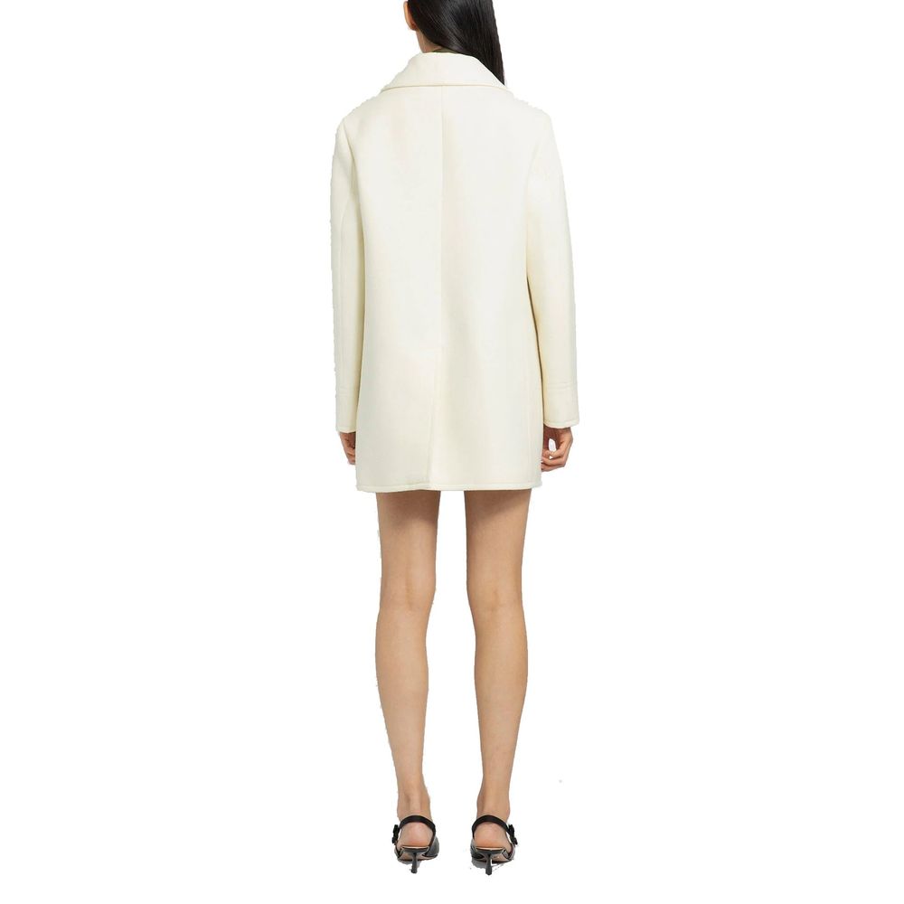 Elevate your wardrobe with the Prada White Wool Coat, a masterpiece of Italian craftsmanship in 100% wool, embodying timeless elegance and sophistication for the discerning individual.