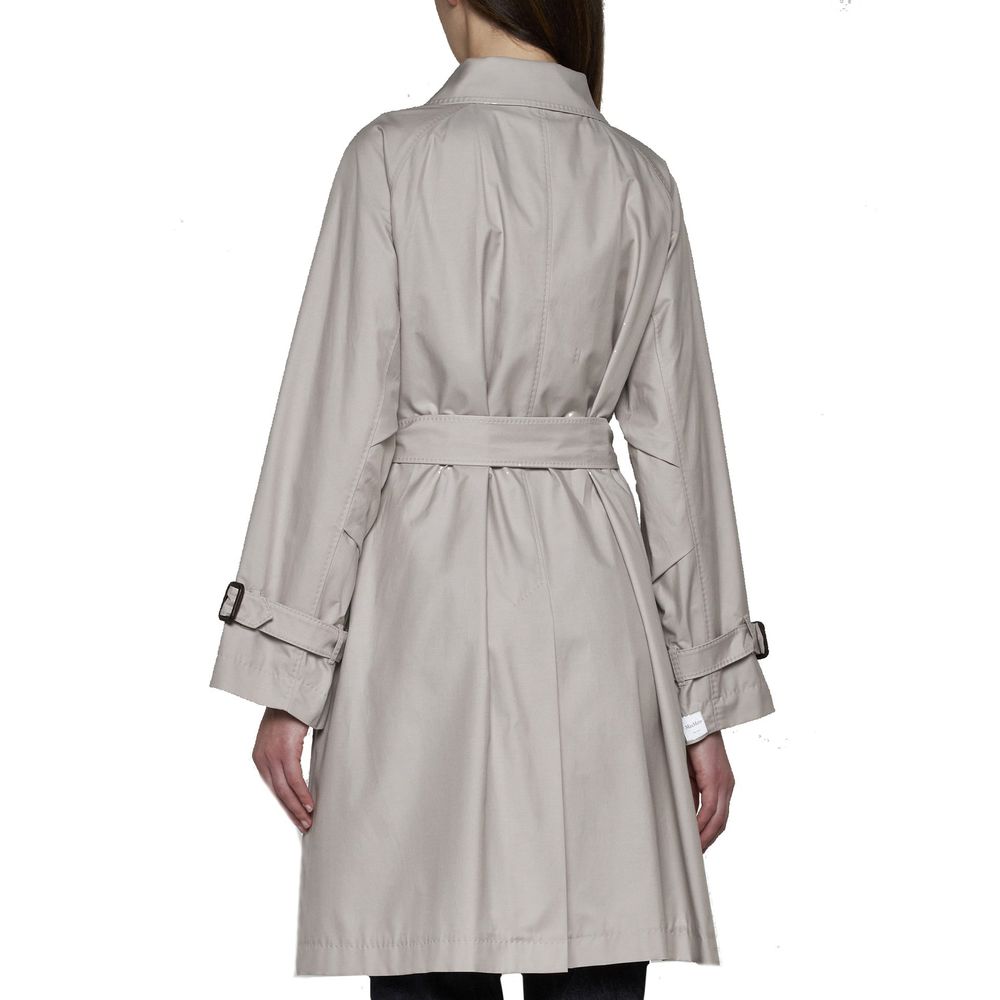 Elevate your wardrobe with the Max Mara Beige Cotton Coat, a masterpiece of Italian craftsmanship blending luxury and versatility for the discerning individual.