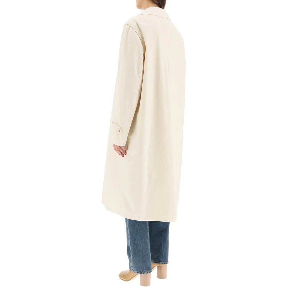 Elevate your wardrobe with the Maison Margiela White Cotton Coat, a masterpiece of Italian craftsmanship that exudes timeless elegance and sophisticated allure.
