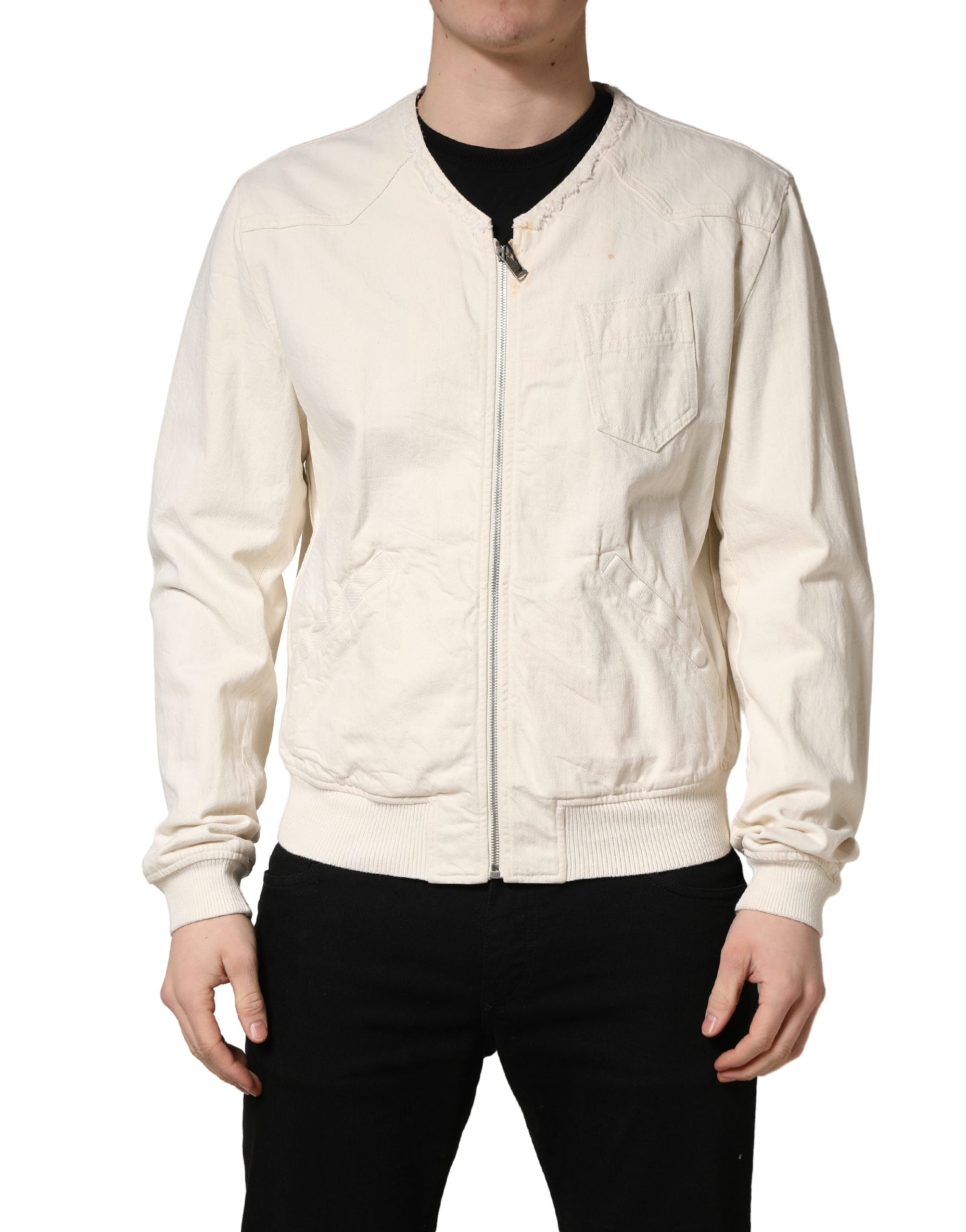Indulge in the exquisite Dolce & Gabbana Off White Cotton Full Zip Denim Blouson Jacket, a timeless blend of luxurious craftsmanship and effortless elegance, perfect for any sophisticated wardrobe.