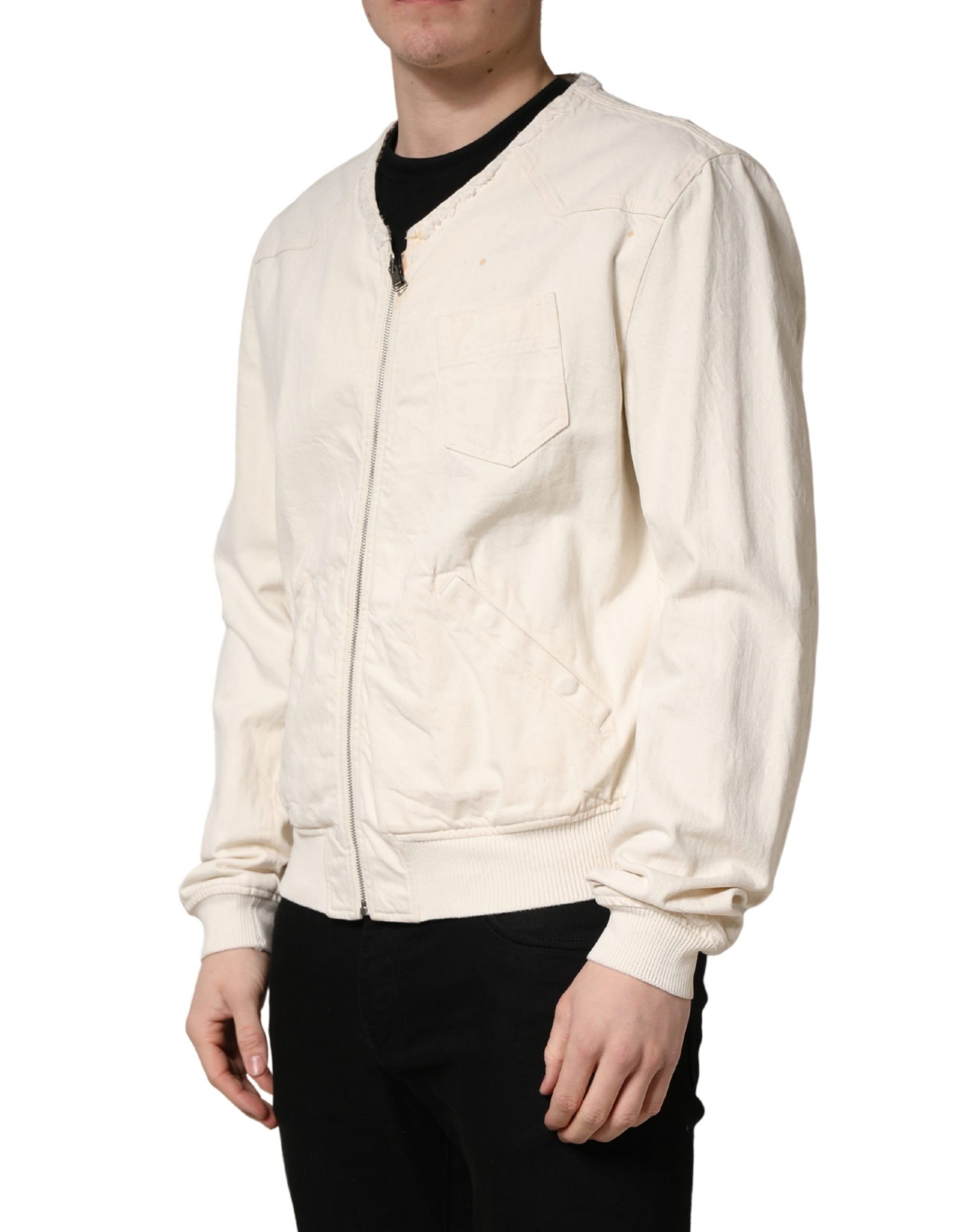Indulge in the exquisite Dolce & Gabbana Off White Cotton Full Zip Denim Blouson Jacket, a timeless piece that embodies luxury and sophistication for the discerning individual.